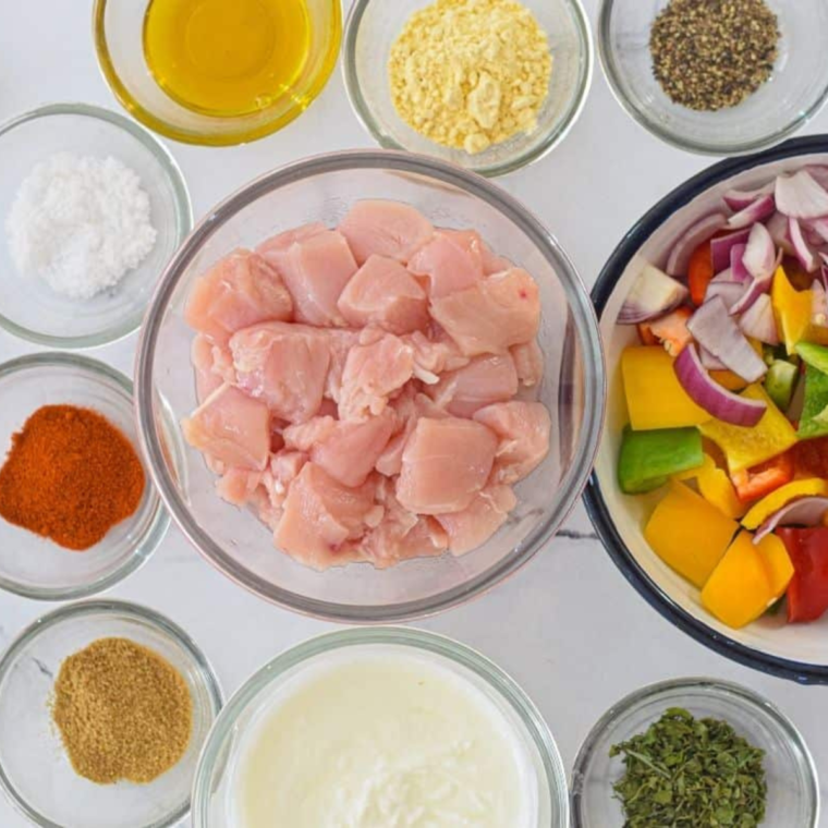 Ingredients needed for Chicken Tikka Salad on kitchen table.