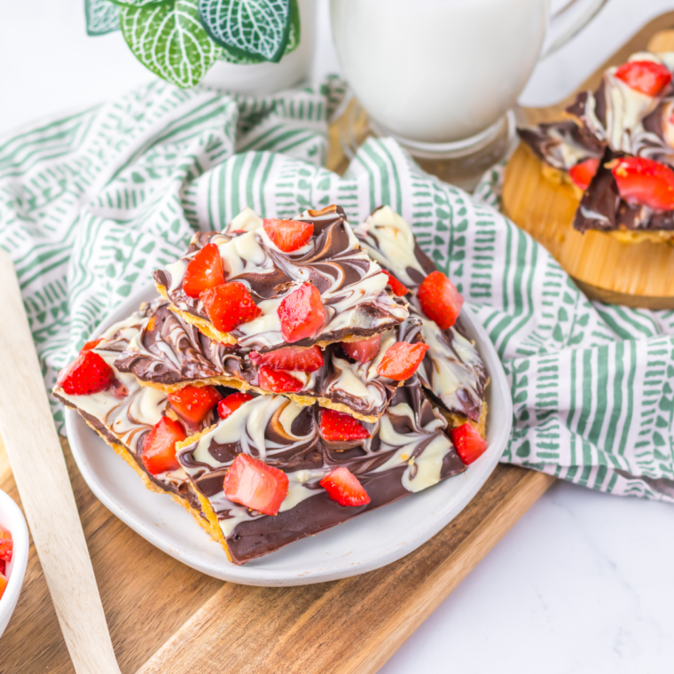 Chocolate Covered Strawberry Bark with a glossy chocolate coating and fresh diced strawberries sprinkled on top.