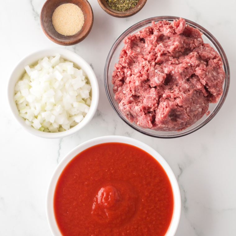 Ingredients needed for Ninja Foodi Spaghetti Bolognese on kitchen table.