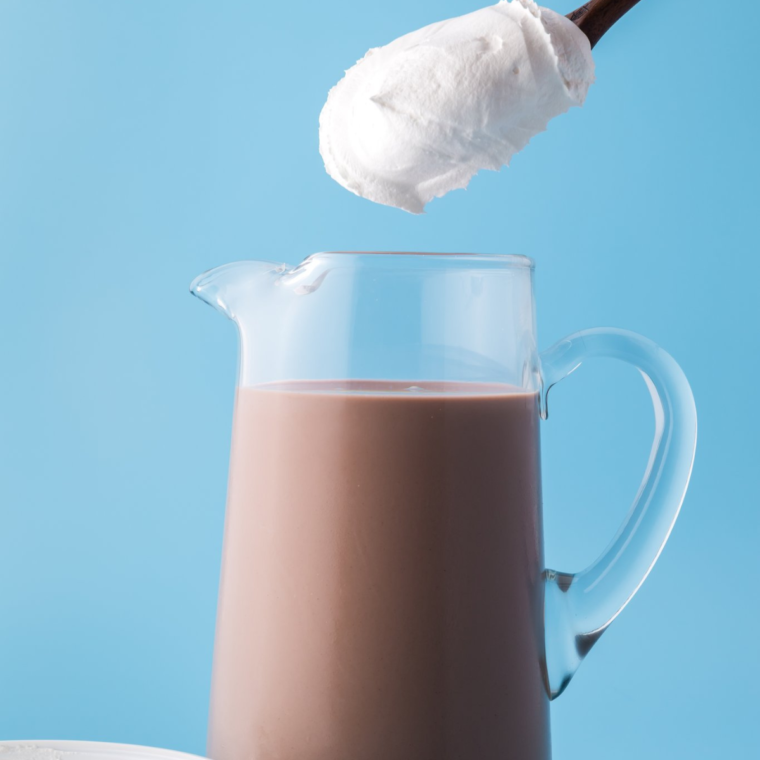 Stirring chocolate milk, sweetened condensed milk, and Cool Whip in a large mixing bowl until smooth.