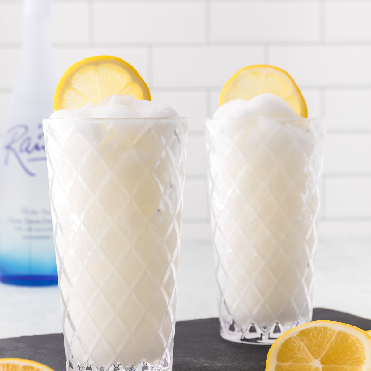"Ninja Slushie Hard Lemonade served in a glass, icy, refreshing, and garnished with a lemon slice."