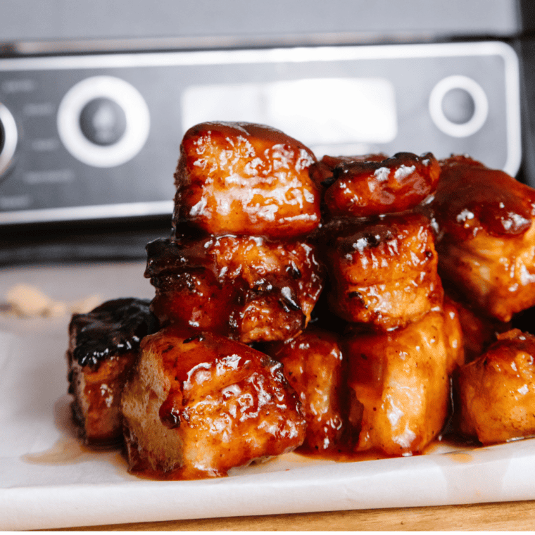 Ninja Smoked Pork Belly Burnt Ends served with a tangy barbecue sauce.