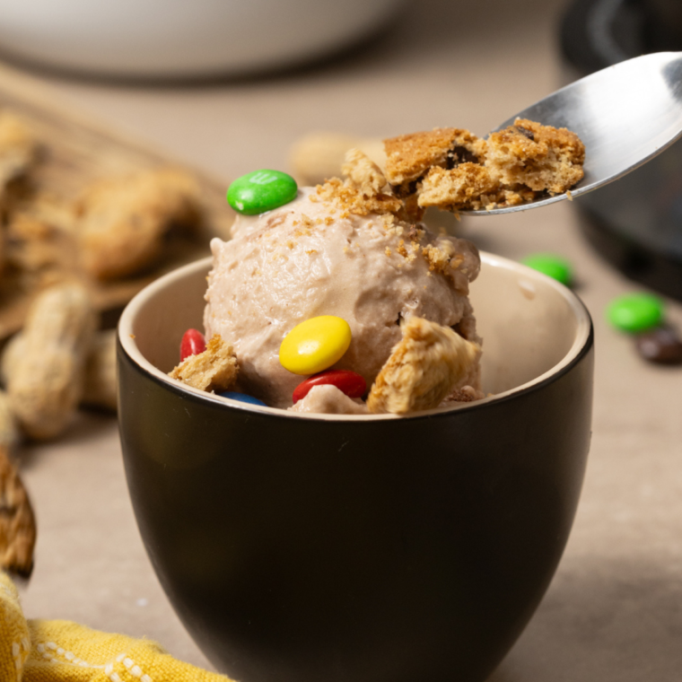 Protein Monster Cookie Ninja Creami Ice Cream topped with M&M’s, cookie crumbles, and peanut butter swirls.