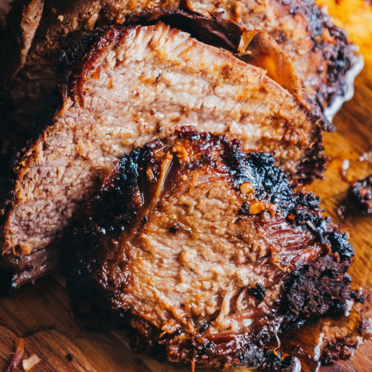 Resting the brisket before slicing: "Allowing the smoked brisket to rest for 10 minutes before slicing or shredding."