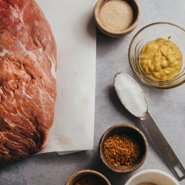 Ingredients needed for Smoked Brisket on a Ninja Woodfire Grill on kitchen table.