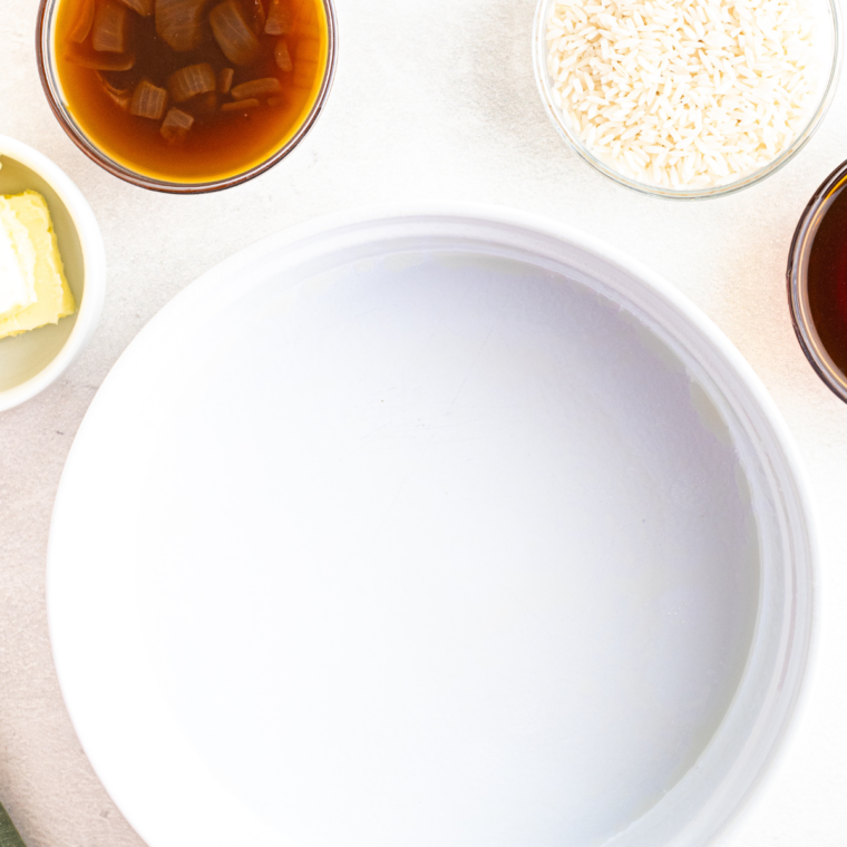 Rinsing long-grain white rice under cold water in a fine mesh strainer until the water runs clear.