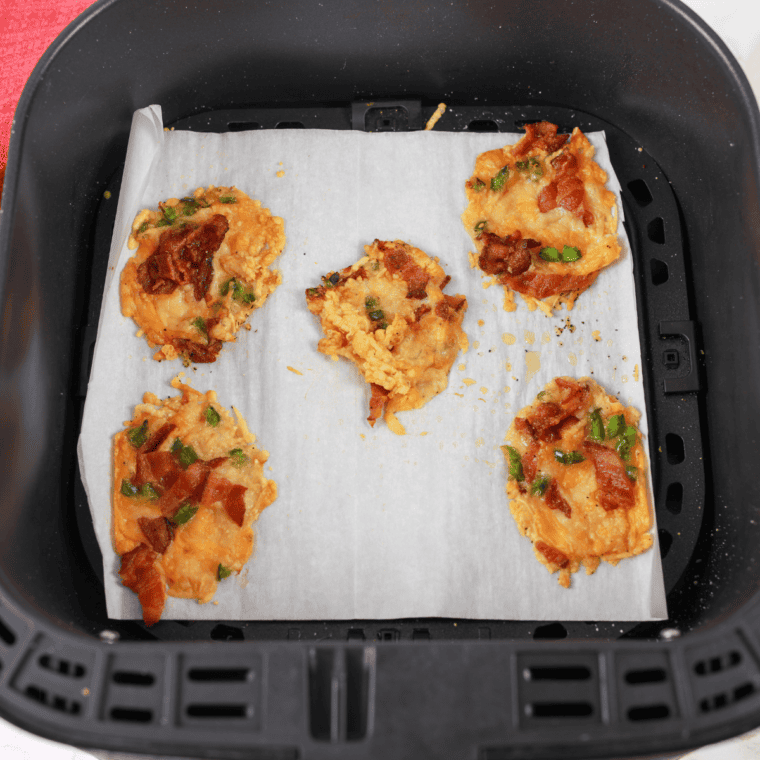 Golden and crispy Air Fryer Jalapeno Popper Crisps with melted cheese and bacon pieces.