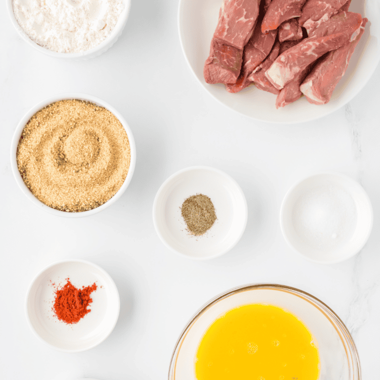 Ingredients needed for Air Fryer Steak Fingers on kitchen table.