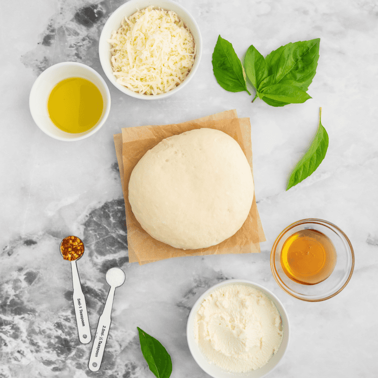 Ingredients needed for Air Fryer White Pizza (Pizza Bianca) on kitchen table.