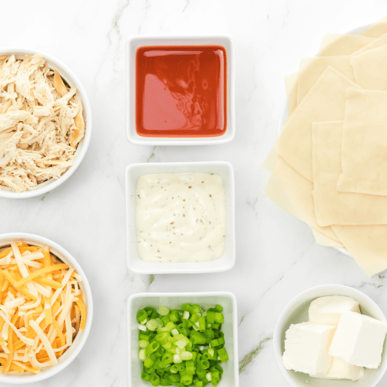 Ingredients needed for Buffalo Ranch Dressing on kitchen table.