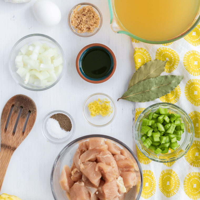 Ingredients needed for Chick Fil A Chicken Noodle Soup (Copycat Recipe) on kitchen table.