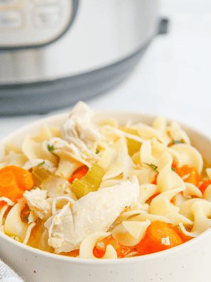 Homemade Chick-fil-A Chicken Noodle Soup served in a bowl with chicken, noodles, and vegetables.