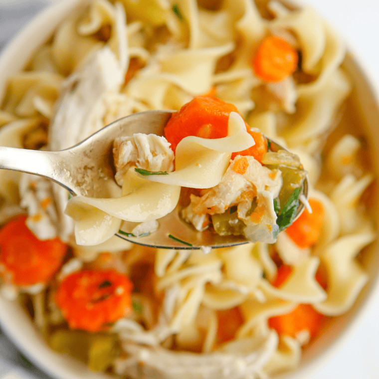 A hearty bowl of Chick-fil-A Chicken Noodle Soup with tender chicken, noodles, and vegetables in a savory broth.