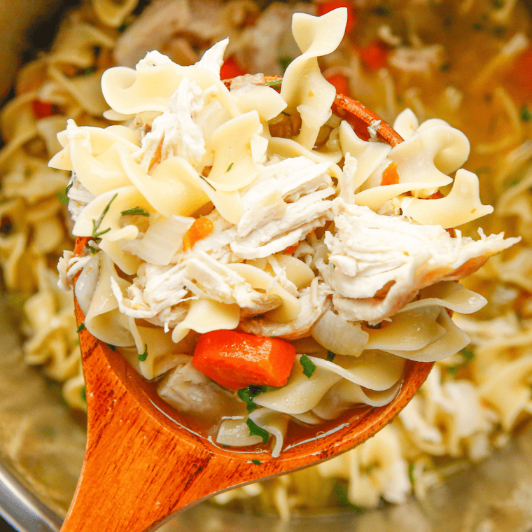 A bowl of homemade Chick-fil-A Chicken Noodle Soup with tender chicken, vegetables, and egg noodles in a flavorful broth.