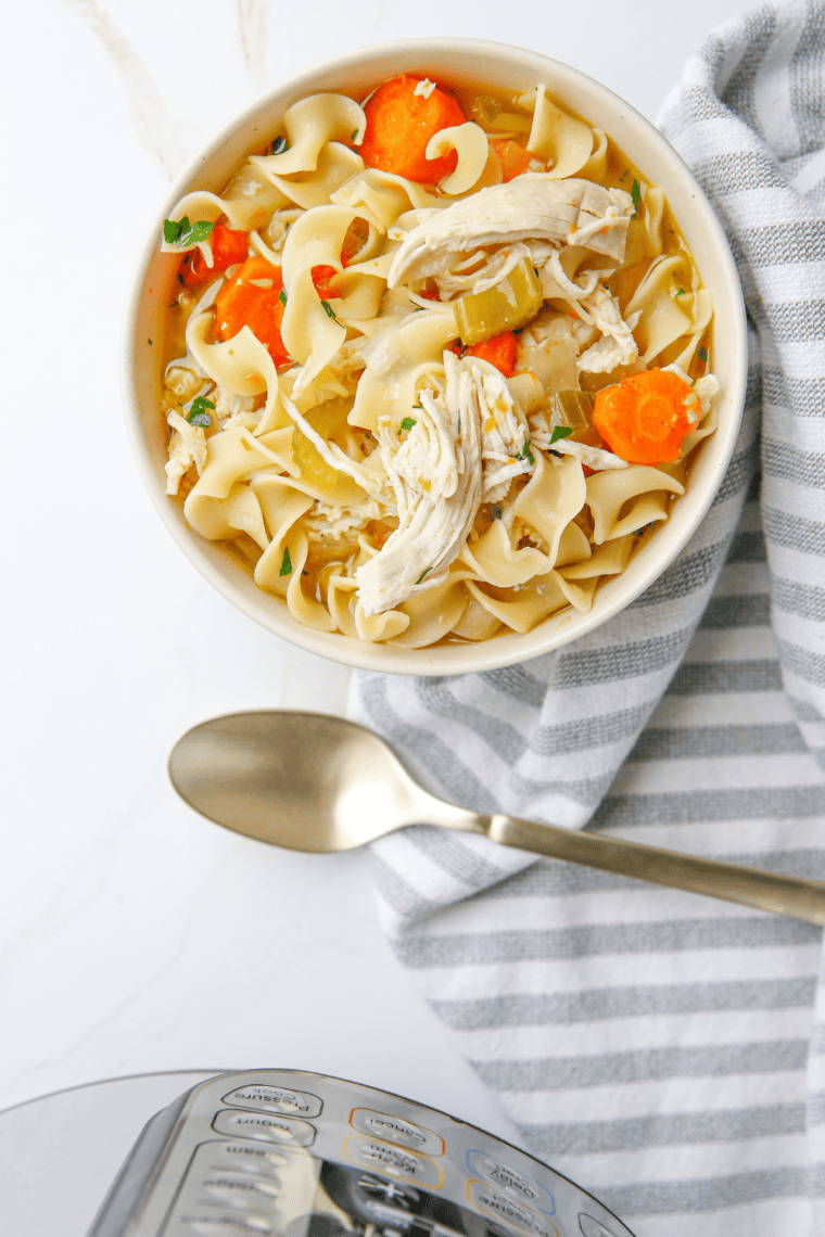 A comforting bowl of homemade Chick-fil-A Chicken Noodle Soup with tender chicken, egg noodles, and vegetables in a flavorful broth.