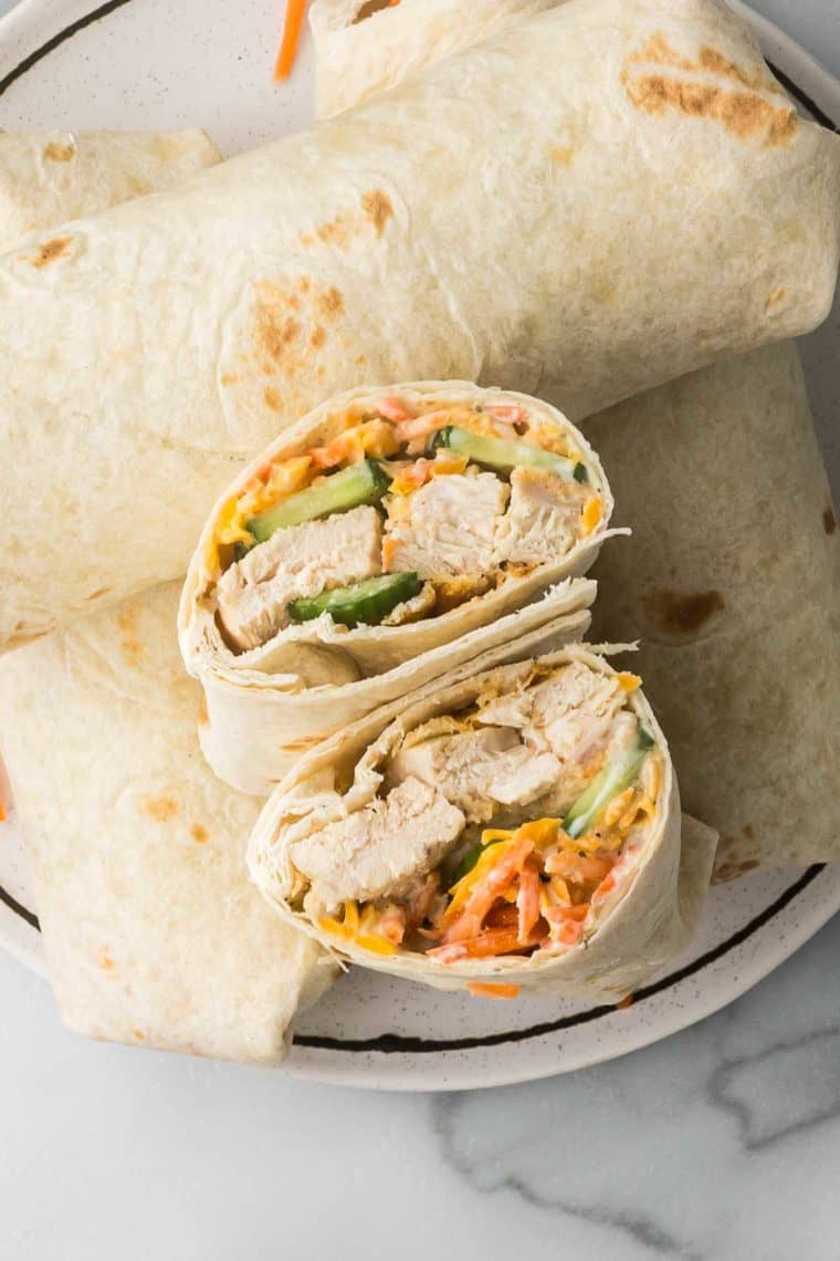 Homemade Chick-fil-A Grilled Chicken Cool Wrap with crispy air-fried chicken, fresh veggies, and creamy dressing wrapped in a flour tortilla.