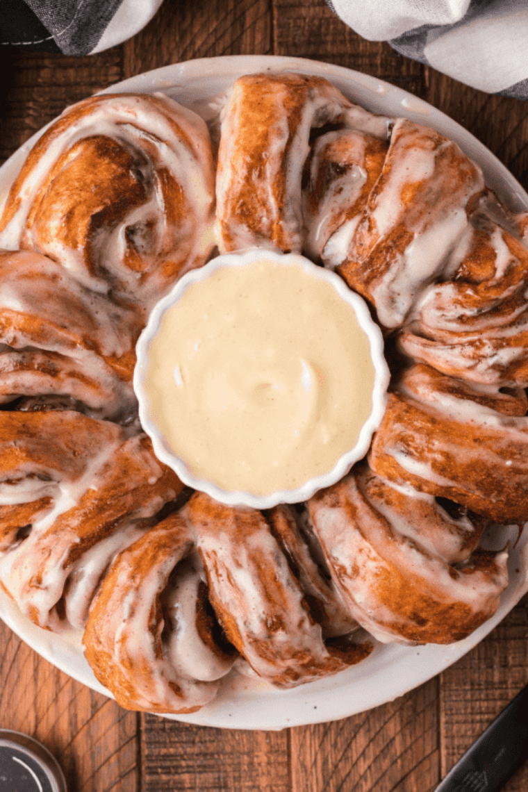 Copycat Cinnabon frosting in a bowl, perfect for cinnamon rolls.