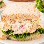Flaky croissant filled with creamy homemade La Madeleine-style chicken salad with almonds and fresh ingredients.
