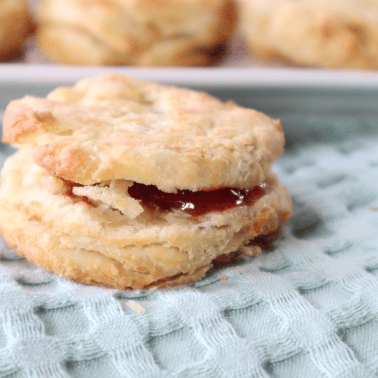 Flaky and golden homemade Popeye's-style biscuits fresh out of the oven.