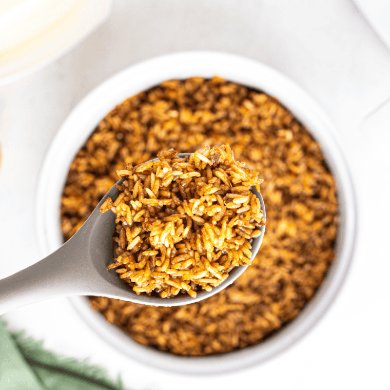 Bowl of Copycat Popeyes Cajun Rice, seasoned with bold spices and savory vegetables, ready to serve.