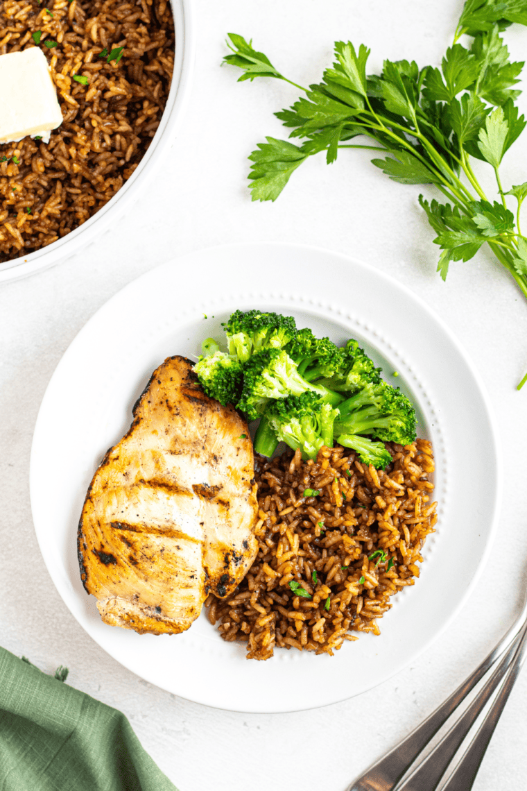 Bowl of Copycat Popeyes Cajun Rice, packed with bold spices and savory vegetables, ready to serve as a delicious side dish.