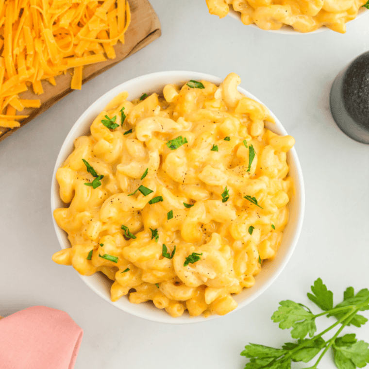 Delicious Mike’s Farm Macaroni and Cheese topped with buttery Ritz crackers and melty cheese, served in a baking dish.