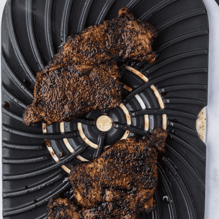 Ribeye steak seasoned with spices and grilled in the Ninja Foodi Grill.