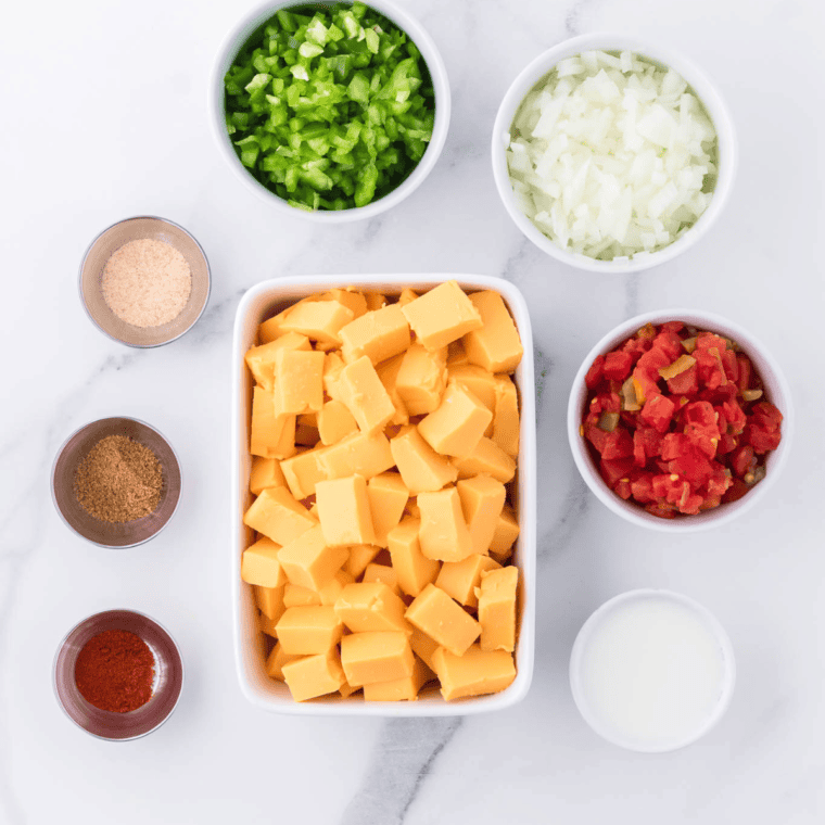 Ingredients needed for Ninja Possible Cooker Queso Dip on kitchen table.