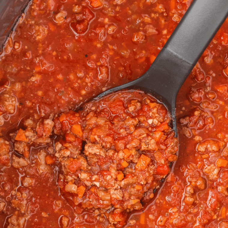 Crockpot Olive Garden meat sauce cooking in a slow cooker