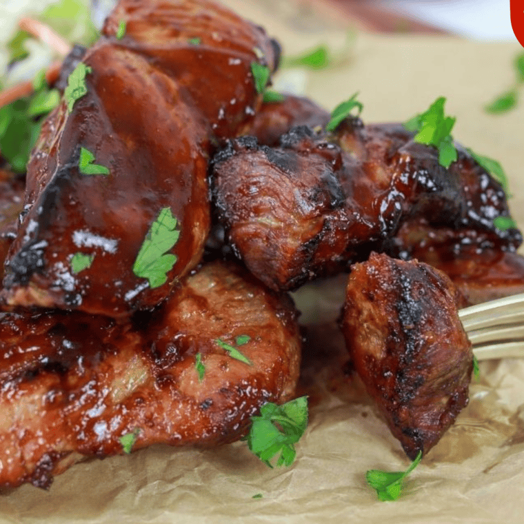 A jar of homemade 3-Ingredient BBQ Sauce with a basting brush, ready for grilling and dipping.