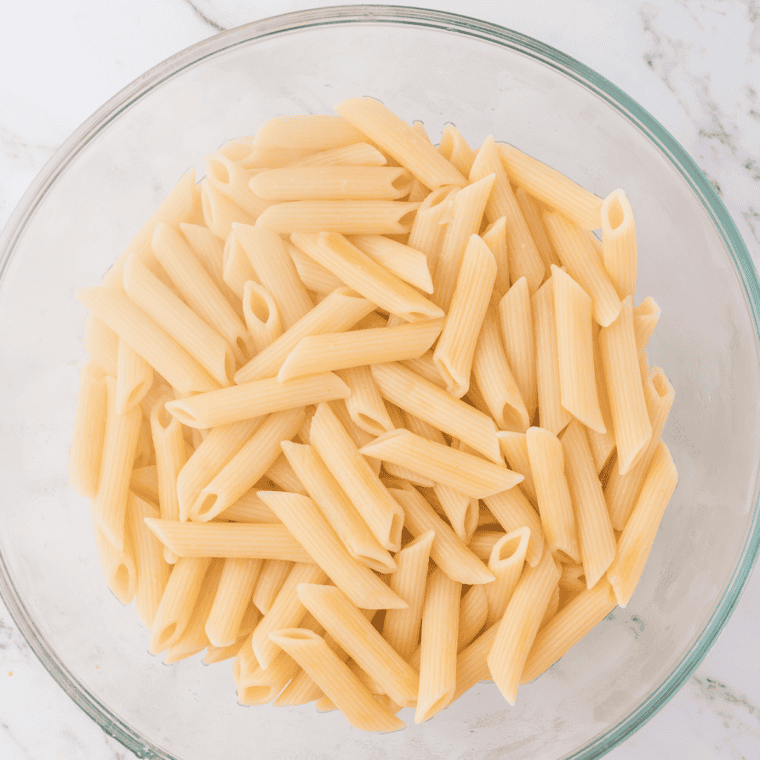 Drained pasta in a clear bowl.