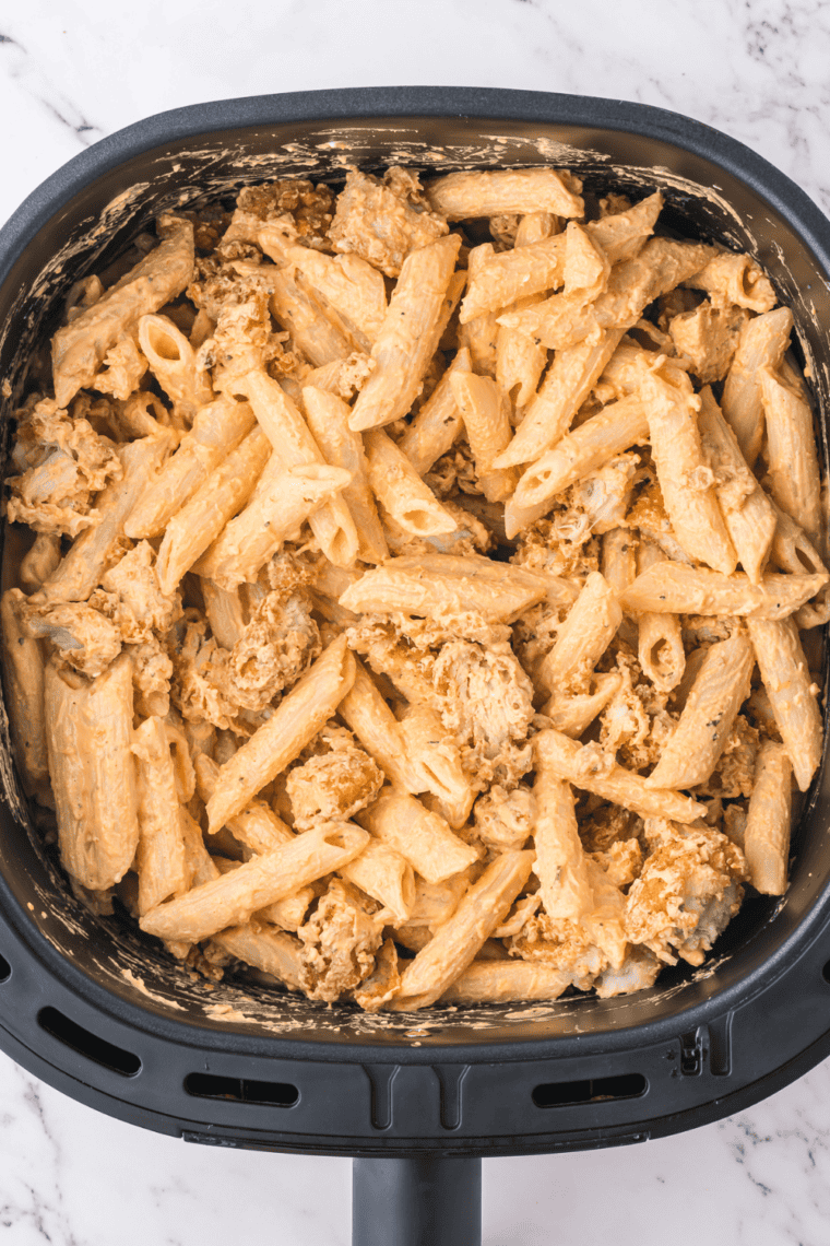 Air fryer buffalo chicken pasta with crispy chicken tenders, creamy sauce, and penne pasta