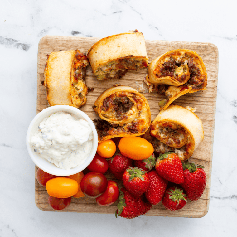 Golden, crispy Air Fryer Cuban Pinwheels filled with ham, Swiss cheese, pickles, and mustard.