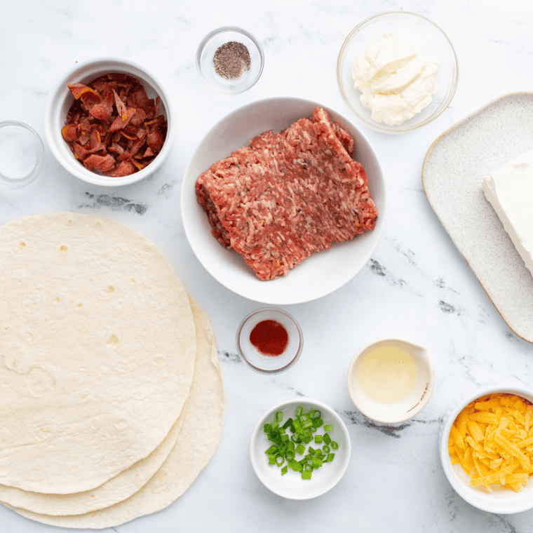 Ingredients needed for Air Fryer Cuban Pinwheels on kitchen table.