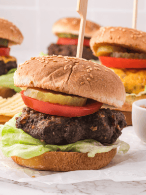 Golden brown Air Fryer Lipton Onion Soup Mix Burgers served on toasted buns with lettuce, tomato, and melted cheese.