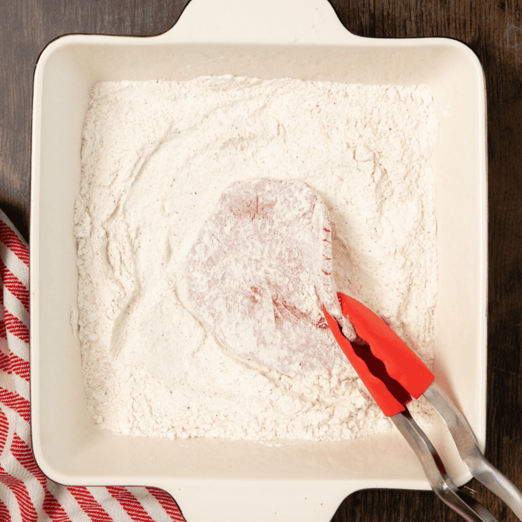 Flour mixture with salt, pepper, and garlic powder, coating steak pieces, with air fryer preheated to 400&deg;F.