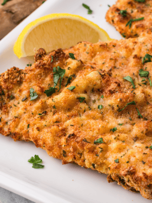 Golden and crispy Air Fryer Veal Scaloppine served with a side of vegetables.