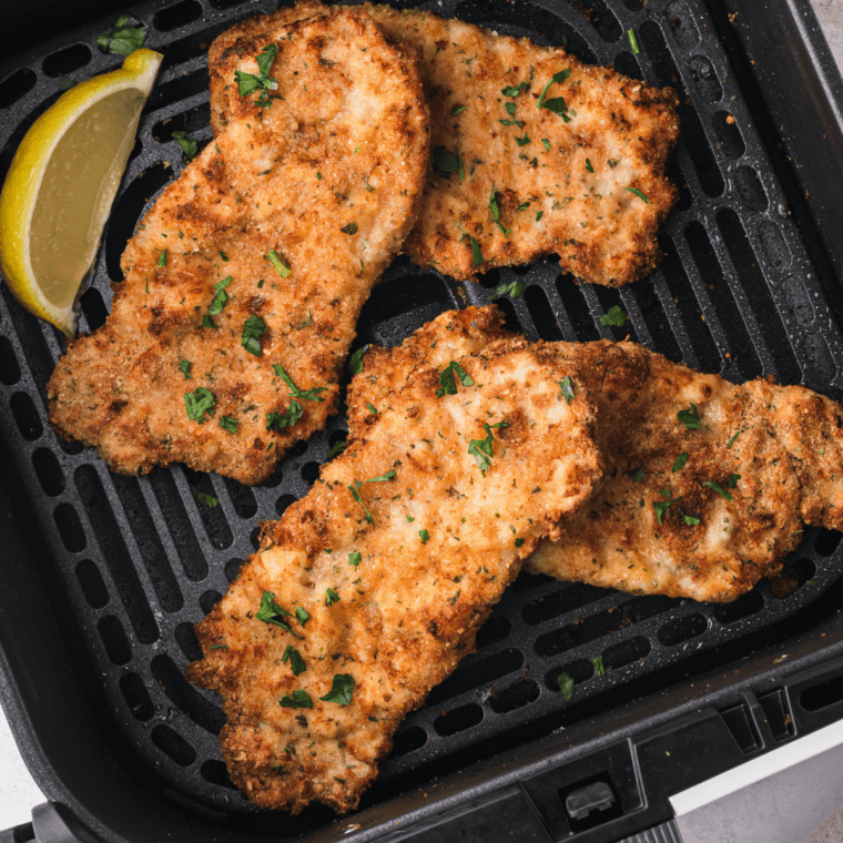 Air Fryer Veal Scaloppine served with a side of vegetables, showcasing crispy golden veal cutlets