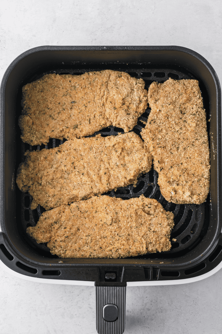 Preheat the air fryer, place breaded veal cutlets in a single layer, and cook until golden and crispy, flipping halfway through.