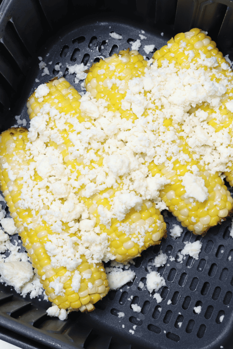 Chili's Roasted Street Corn with creamy sauce, chili powder, and cotija cheese on grilled corn