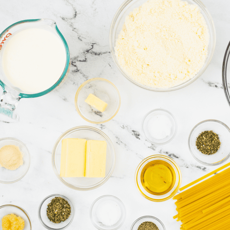 Ingredients needed for Copycat Carrabba’s Alfredo on kitchen table.