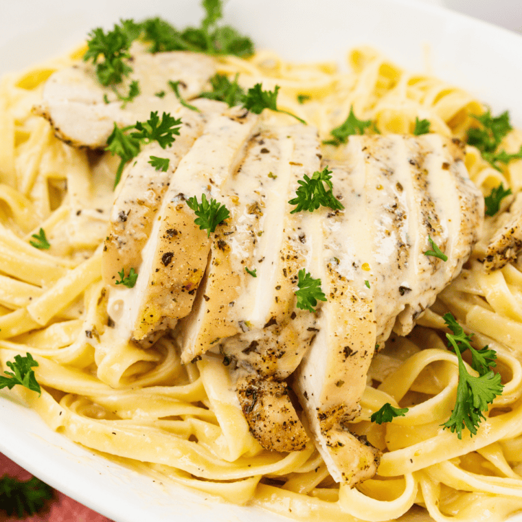 Delicious and creamy Copycat Carrabba’s Alfredo sauce served with pasta