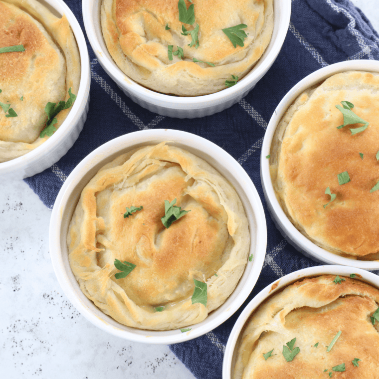 A homemade KFC Chicken Pot Pie with a golden crust, filled with tender chicken, vegetables, and a rich, creamy sauce.