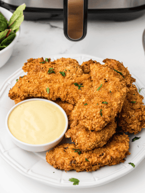 Golden and crispy homemade chicken strips with a seasoned coating.