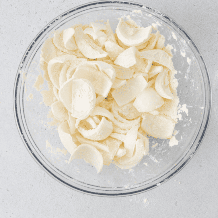 Flour, cornstarch, baking powder, garlic powder, paprika, salt, and pepper whisked together in a bowl.