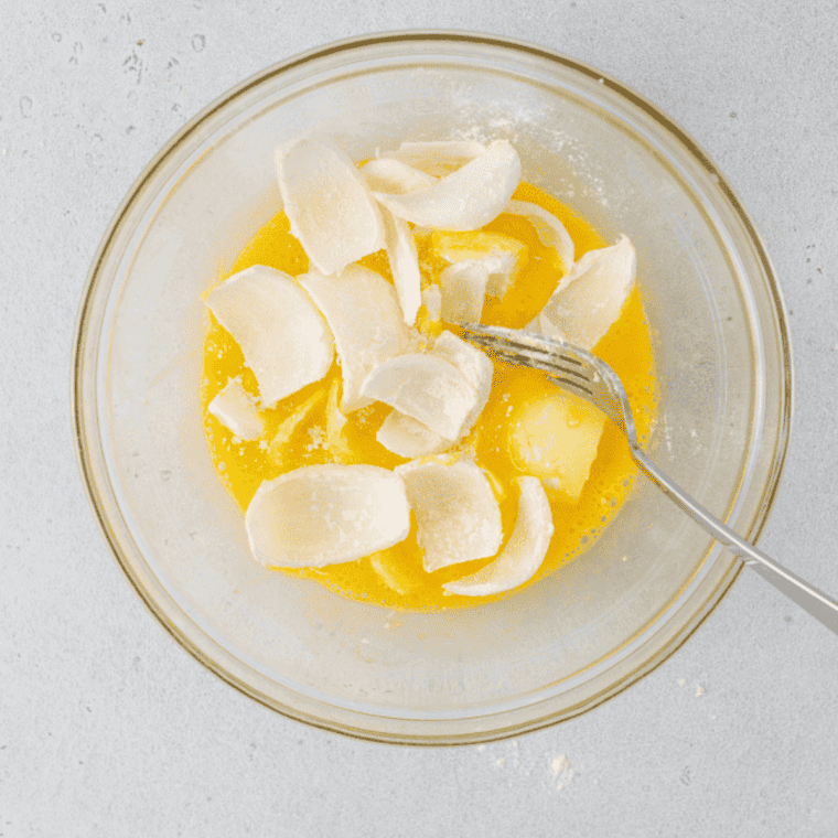 Eggs and buttermilk beaten together in a separate bowl.