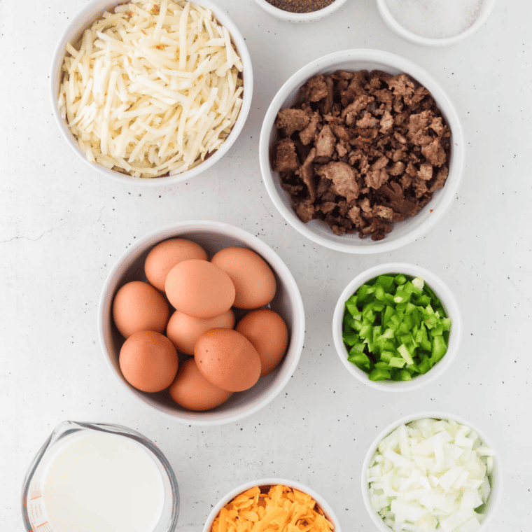 Ingredients needed for Ninja Foodi Possible Cooker Pro Breakfast Casserole on kitchen table.