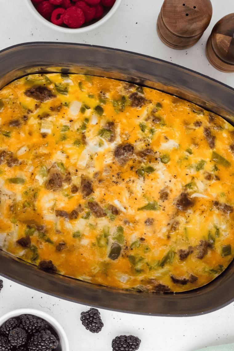 Delicious Ninja Foodi Possible Cooker Pro Breakfast Casserole with hash browns, sausage, eggs, peppers, onions, and cheese.