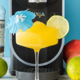 Enjoy a refreshing Ninja Slushi Mango Daiquiri made with sweet mango, rum, and lime, perfect for cooling off on a warm day. Simple and tropical!