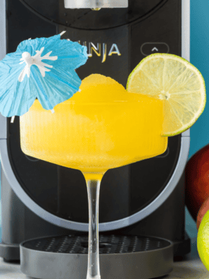 Enjoy a refreshing Ninja Slushi Mango Daiquiri made with sweet mango, rum, and lime, perfect for cooling off on a warm day. Simple and tropical!